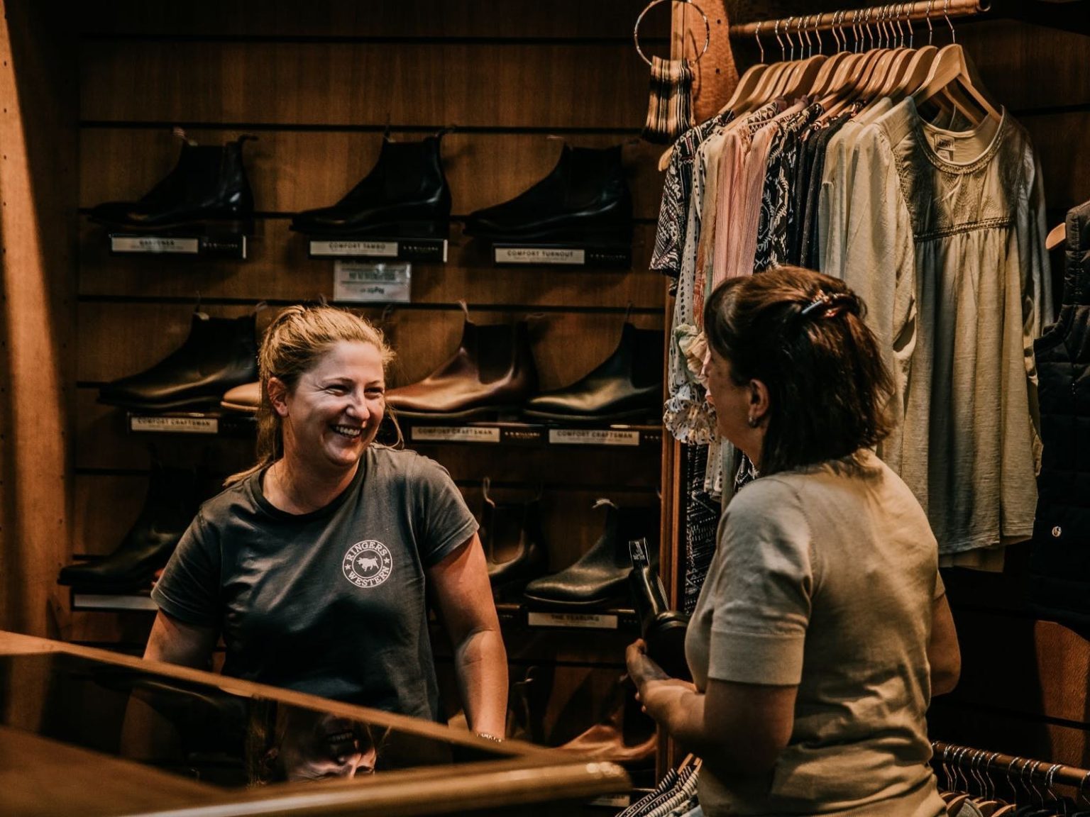 2 women talking in shop